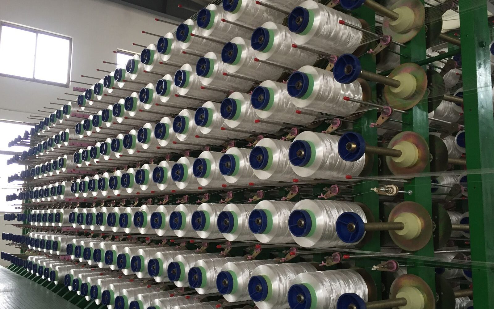 Rows of braiding machines producing braided fishing line